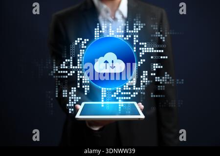Cloud storage technology is shown on a tablet in a business setting Stock Photo