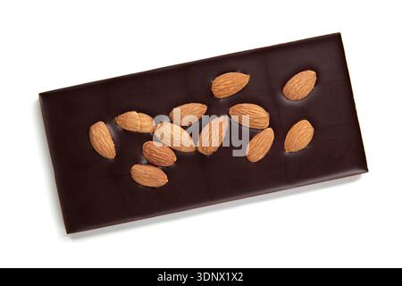 A bar of dark chocolate with whole almonds isolated on a white background. Stock Photo
