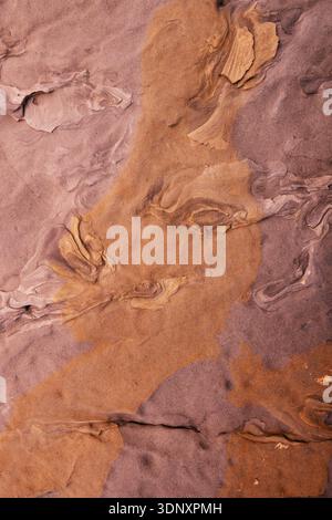 Captivating sandstone rock formations with unique shapes created by water erosion. The intricate patterns on the eastern Asturias coast showcase natur Stock Photo