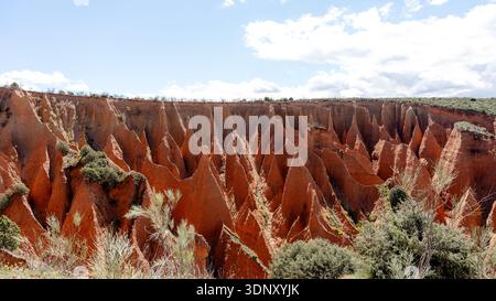 Stunning view of the unique sandstone pillars at Las Carcavas in Guadalajara, Spain. Erosive processes have shaped these magnificent red rock formatio Stock Photo