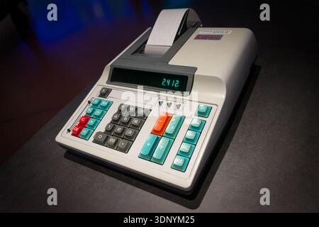 Close up of an old printing calculator displaying a number with a paper receipt feeding out of the top Stock Photo