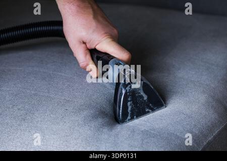 Professional cleaning of the upholstery on a sofa Stock Photo