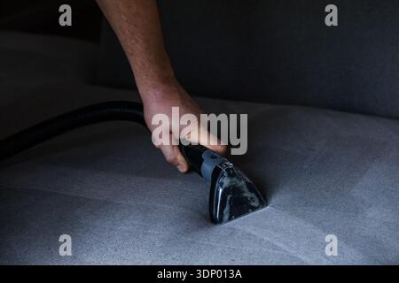 Professional cleaning of the upholstery on a sofa Stock Photo