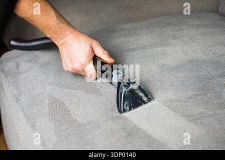 Professional cleaning of the upholstery on a sofa Stock Photo
