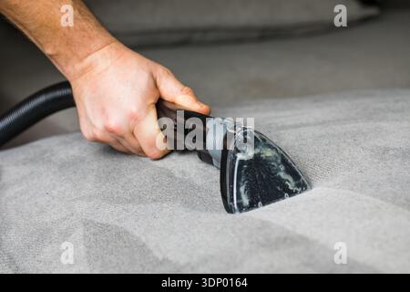 Professional cleaning of the upholstery on a sofa Stock Photo