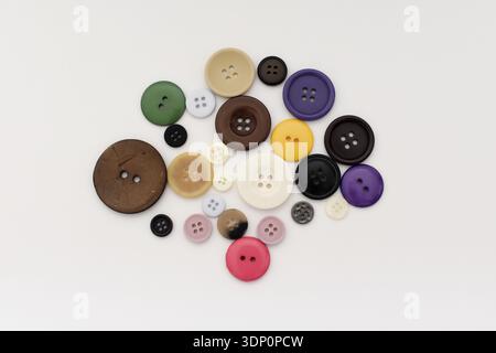 Colorful Buttons on White Table, Top View Flat Lay Stock Photo