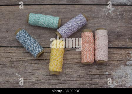 Colorful Thread Spools on Wooden Table, Top View Flat Lay Stock Photo