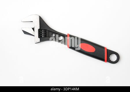 Adjustable wrench for plumbers and gas fitters on an isolated white background Stock Photo
