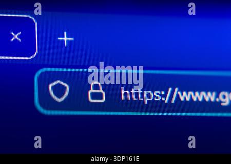 Close-up of a secure web browser address bar with HTTPS protocol, padlock icon, and shield symbol, representing internet security, data privacy, and e Stock Photo