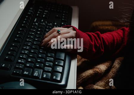 Woman Typing on Computer Keyboard Stock Photo