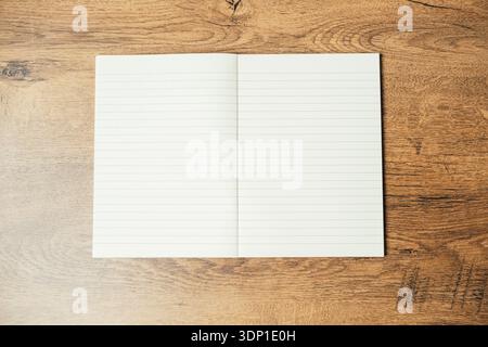 Plain Journal Invites Reflection. Empty Notebook With Lined Pages Resting On Wooden Table Surface Stock Photo