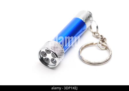 Blue LED flashlight with the ability to recharge from the mains on an isolated white background Stock Photo