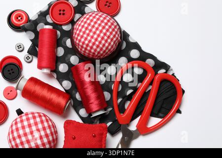 Different sewing supplies on white background, flat lay Stock Photo