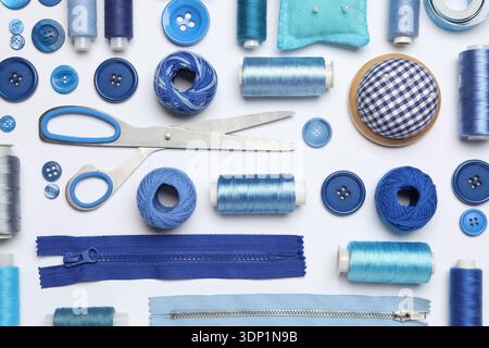 Flat lay composition with sewing supplies on white background Stock Photo