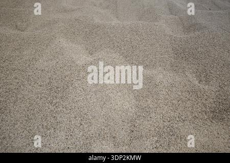 Rough Mediterranean sand texture close up, summer tine Stock Photo