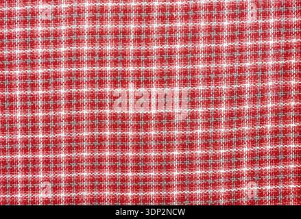 Woven wool fabric as a creative backdrop. Wool fabric texture. Threads texture as background in red Stock Photo