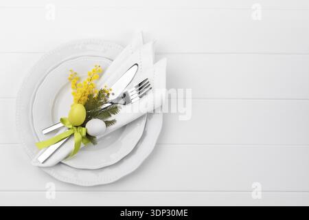 Spring table setting with mimosa easter holidays dinner Stock Photo