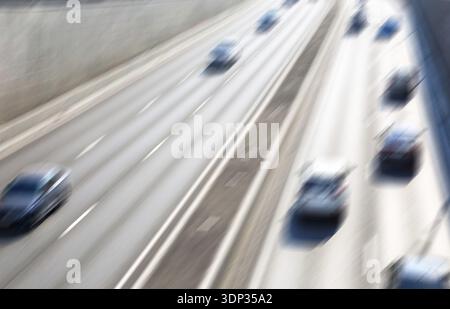 Blurred background of traffic on city street in summer Stock Photo