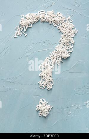 Question mark made of English letters on blue background Stock Photo