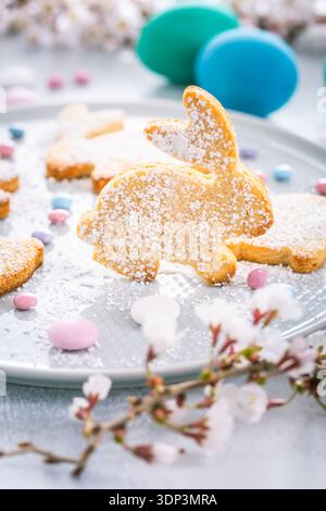 Easter bunny almond cookies and Easter eggs on decorated festive table Stock Photo