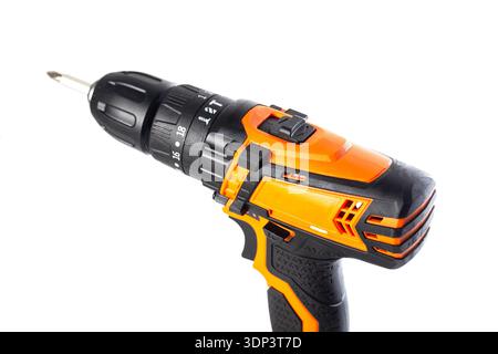 Close up detail view of powerful cordless drill screwdriver featuring bright orange and black housing, focusing on textured grip, speed control, and t Stock Photo