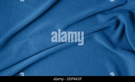 Pure natural cashmere is toned in a fashionable color, classic blue. Abstract background in a trending color according to Pantone. With copy space, to Stock Photo