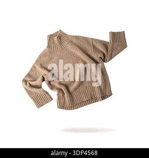 Soft casual  light brown or beige sweater of luxury natural cashmere wool flying isolated on white background. Autumn and winter pure wool clothing. K Stock Photo