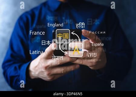 Close-up of hands using a smartphone translation app with multiple languages on screen, symbolizing multilingual communication, localization, travel, Stock Photo
