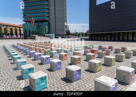 A unique outdoor installation featuring large periodic table blocks in a modern urban setting. Stock Photo