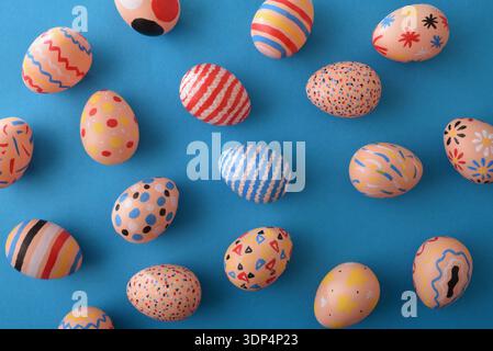 Colorful Patterned Easter Eggs on Blue Background Stock Photo