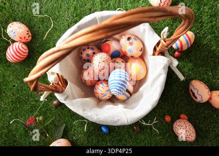 Basket of Colorful Easter Eggs Top View Stock Photo