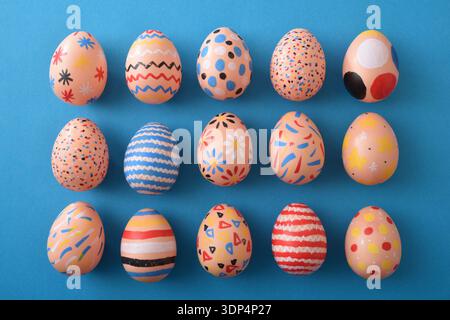 Assorted Hand-Painted Easter Eggs Flat Lay Stock Photo