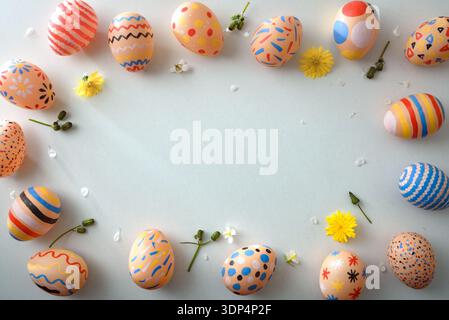 Colorful Easter Eggs Frame with Spring Flowers Stock Photo
