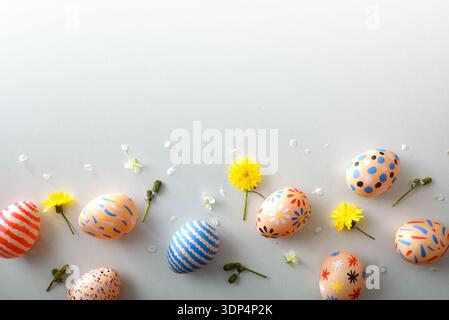 Decorated Easter Eggs with Spring Flowers Border Stock Photo