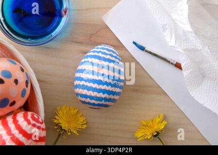 Hand-Painted Easter Eggs with Dye and Flowers Stock Photo