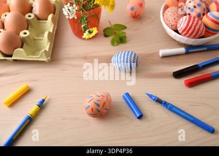 DIY Easter Egg Painting on Wooden Table Stock Photo