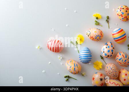Scattered Painted Easter Eggs on Pastel Background Stock Photo
