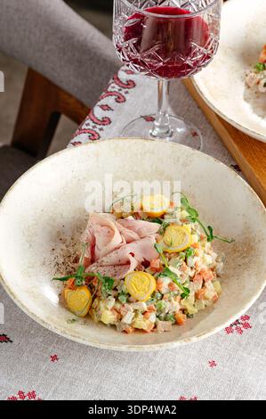 Olivier salad with quail eggs Stock Photo