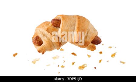 Buttery croissants with sausage and crumbs  isolated on white background. Crusty sausage croissant roll as tasty snack. Pastry banner. Food collection Stock Photo