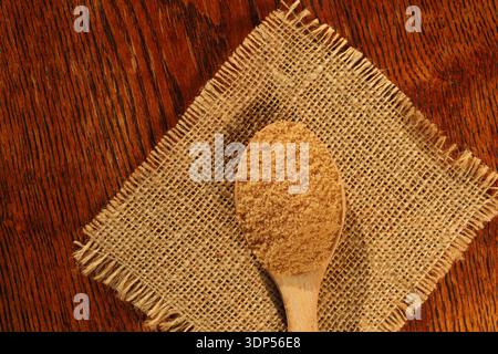 brown sugar on wooden spoon Stock Photo
