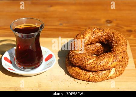 turkish tea and turkish bagels (simit) on wooden surface Stock Photo