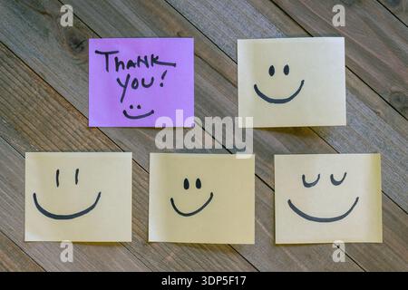 Thank you handwritten text on sticky notes for gratitude and appreciation concept flat lay Stock Photo