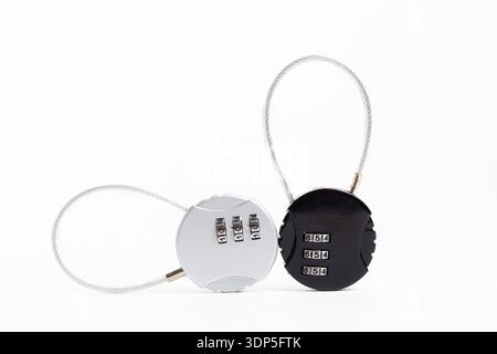 Close-up of silver and black combination cable locks on white background. Stock Photo