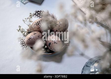 Rustic Easter still life with olive eggs and decor. Stock Photo