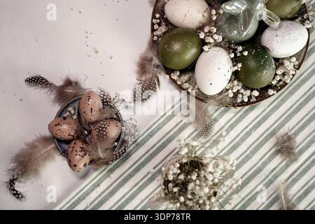 Rustic Easter still life with olive eggs and decor. Stock Photo