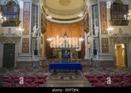 Chiesa di San Francesco Borgia, Catania, Italy. Sicilian Baroque church interior set up with temporary clear chairs and a presentation table facing th Stock Photo