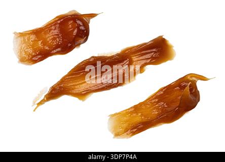 Sweet caramel sauce splashes dripping with a rich texture, isolated on transparent Stock Photo