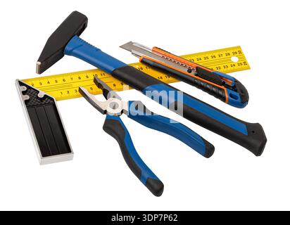 Hand tools including hammer, pliers, utility knife, ruler, and square ready for work Stock Photo