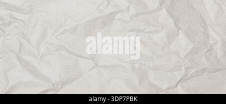 Crumpled white paper showing wrinkled and folded surface texture Stock Photo