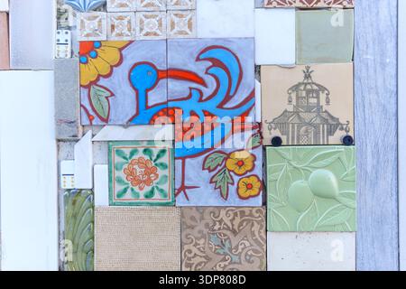 Santa Barbara, California - December 29, 2025: Artistic mixed-media mosaic wall featuring hand-painted ceramic tiles with a blue bird, flowers, and ge Stock Photo